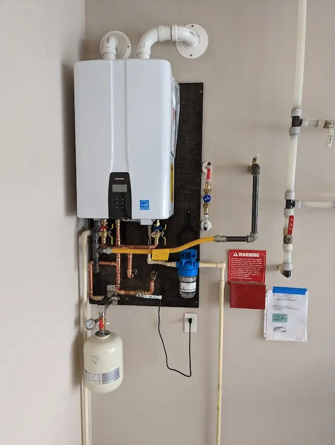 Professional plumber installing copper piping in a Jefferson City home